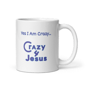 White ceramic mug with bold “Yes i am crazy crazy 4 jesus” text in blue calligraphy